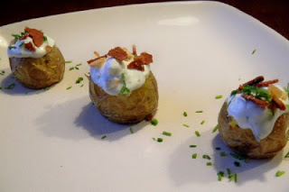 Mini stuffed potatoes served on a white plate