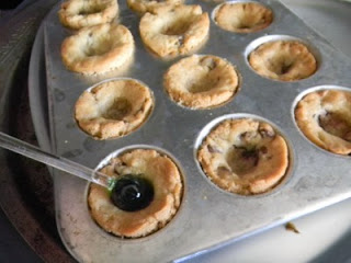 pushing in the center of the cooked cookies