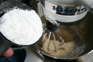 powdered sugar being added to stand mixer