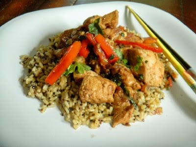 Thai Garlic & Basil Chicken served on a white plate