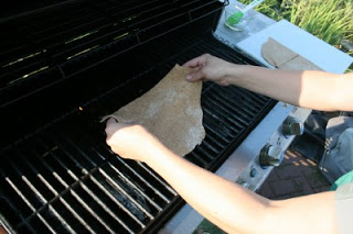 laying dough on oiled grill