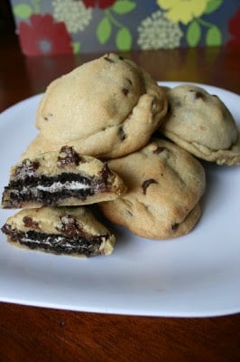 Oreo Stuffed Chocolate Chip Cookies stacked on a white plate