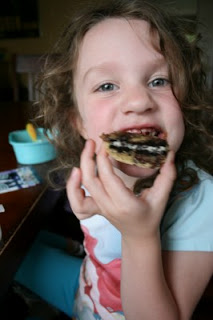 child eating a Oreo Stuffed Chocolate Chip Cookie