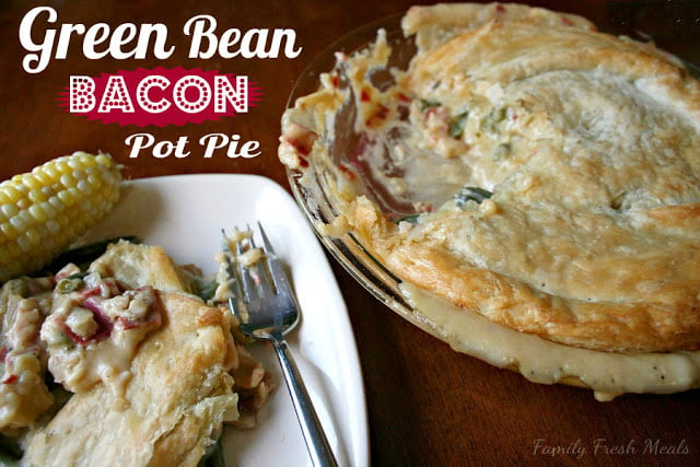 Cheesy Green Bean & Bacon Pot Pie , served on a white plate with a side of corn on the cob