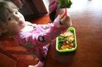 child sitting at a table eating Change of Season Lunchbox Idea