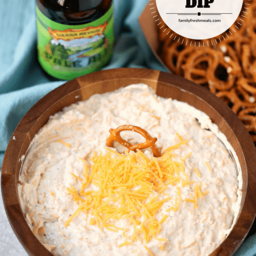 Beer Dip served in a bowl with pretzels on the side