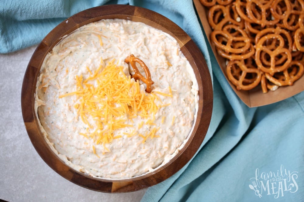 Beer Dip Recipe in a wooden bowl with pretzels on the site