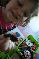 child sitting at a table looking at the Bento Love: Nightmare Before Christmas Lunchbox