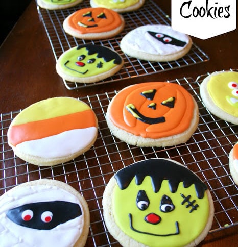 Halloween decorated sugar cookies on a cooling rack