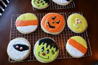 Halloween decorated sugar cookies on a cooling rack