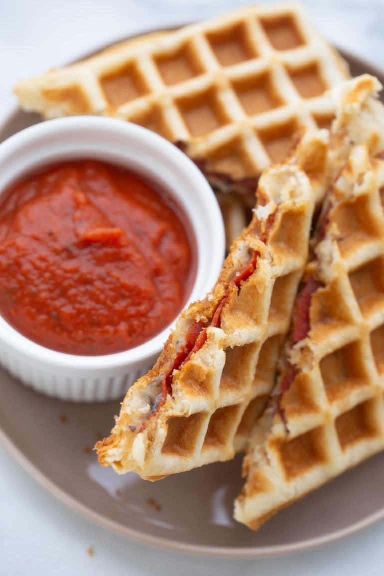 Waffle Pizza Dippers on a plate with sauce