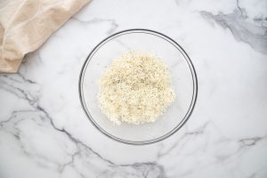 shredded cheese and herbs in a bowl