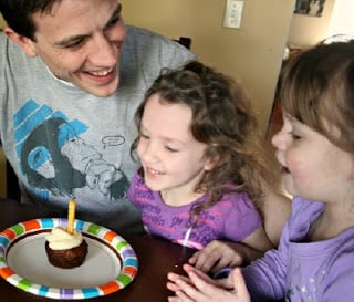 Father with 2 daughters smiling with Carrot Cake Cupcake