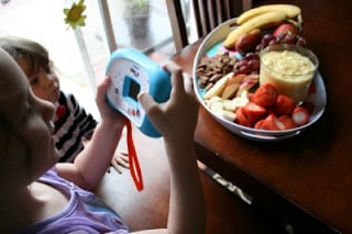 children pretending to take of picture of the Creamy Fruit Dip