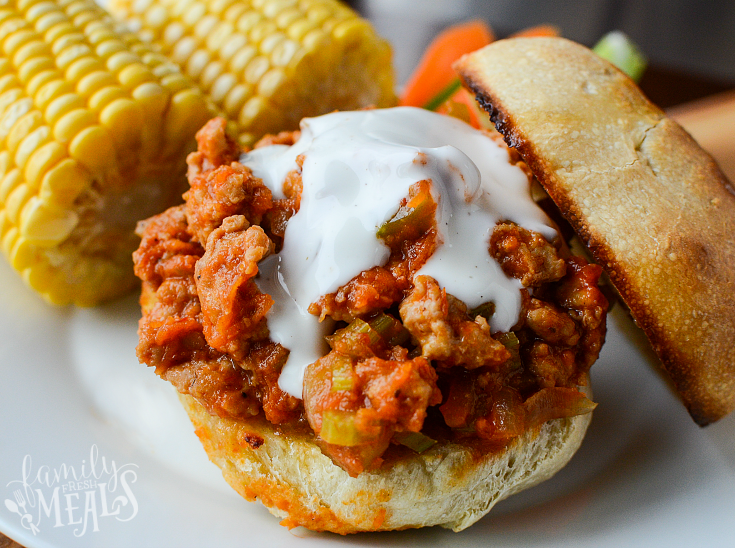 Buffalo Sloppy Joe served on a bun and topped with a white sauce