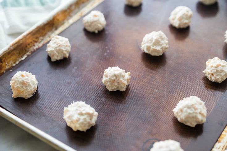 Mini Cheese Balls - mini cheese balls rolled and placed on a baking sheet