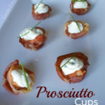 Prosciutto Cups with Cheese & Herb Filling served on a white plate