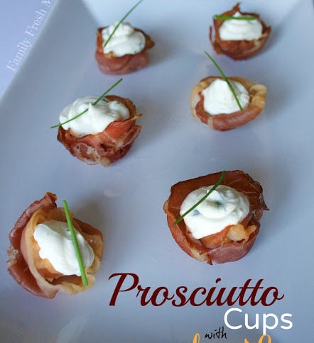 Prosciutto Cups with Cheese & Herb Filling served on a white plate
