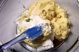 mixing together cream puff filling in a large mixing bowl