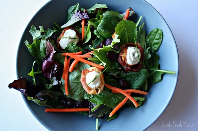 Prosciutto Cups with Cheese filling served on top of a salad