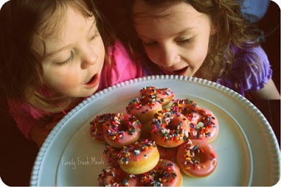 Mini Baked Donuts on a platter with 2 children looking at them