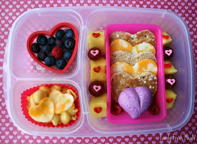 Top down picture of lunch box filled with heart shaped food