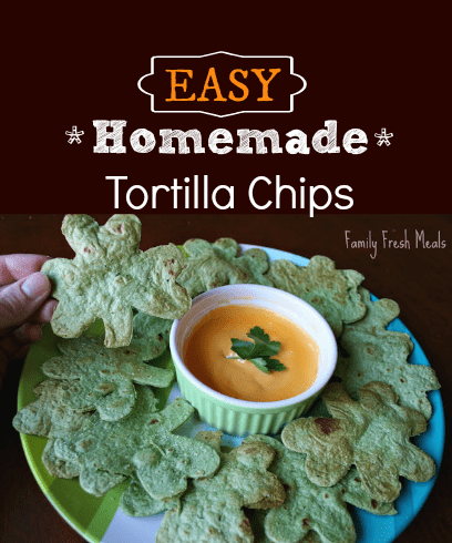 EASY Homemade Tortilla Chips served on a plate with cheese dipping sauce