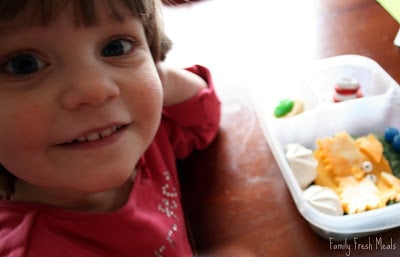 child sitting at the table with Dr. Seuss themed lunchbox