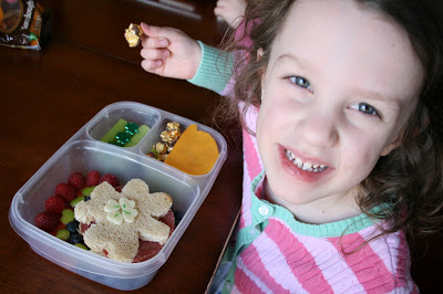 Child sitting at a table, eating St. Patrick's Day theme lunch