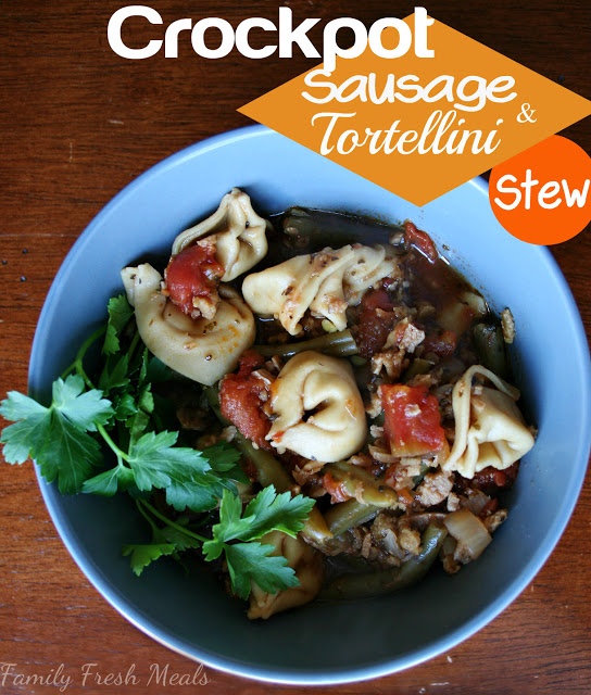 Crockpot Sausage Tortellini Stew served in a blue bowl