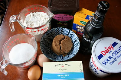 Ingredients for Guinness Chocolate Cupcakes with Baileys Cream Cheese Frosting on a table