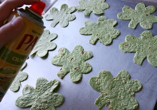 Shamrock shaped tortilla piece laid out on a baking sheet