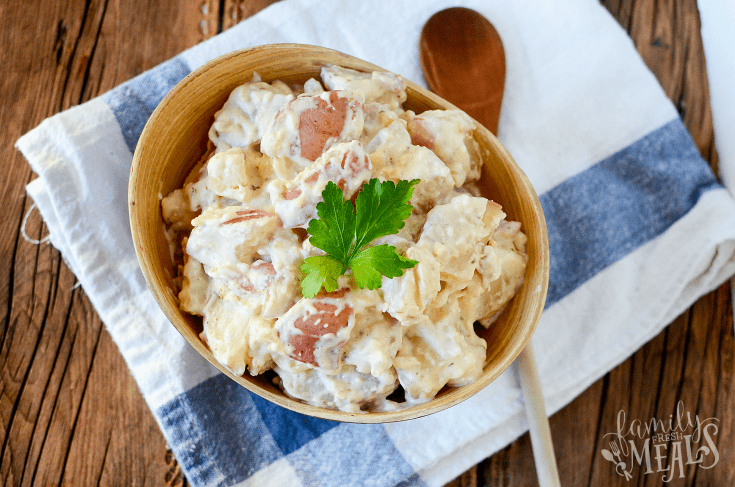 Creamy Ranch Crockpot Potatoes served in a wooden bowl