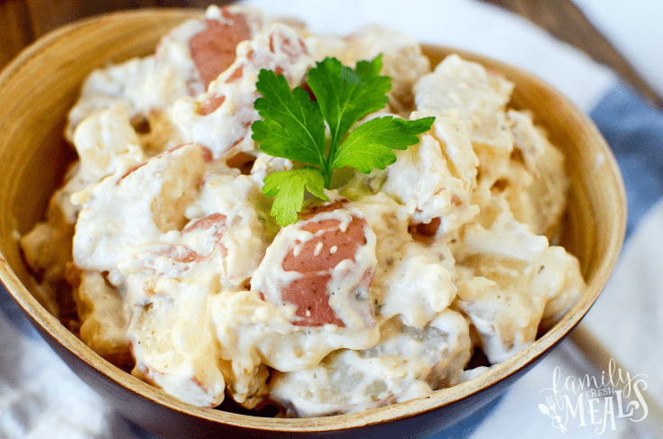 Creamy Ranch Crockpot Potatoes served in a wooden bowl