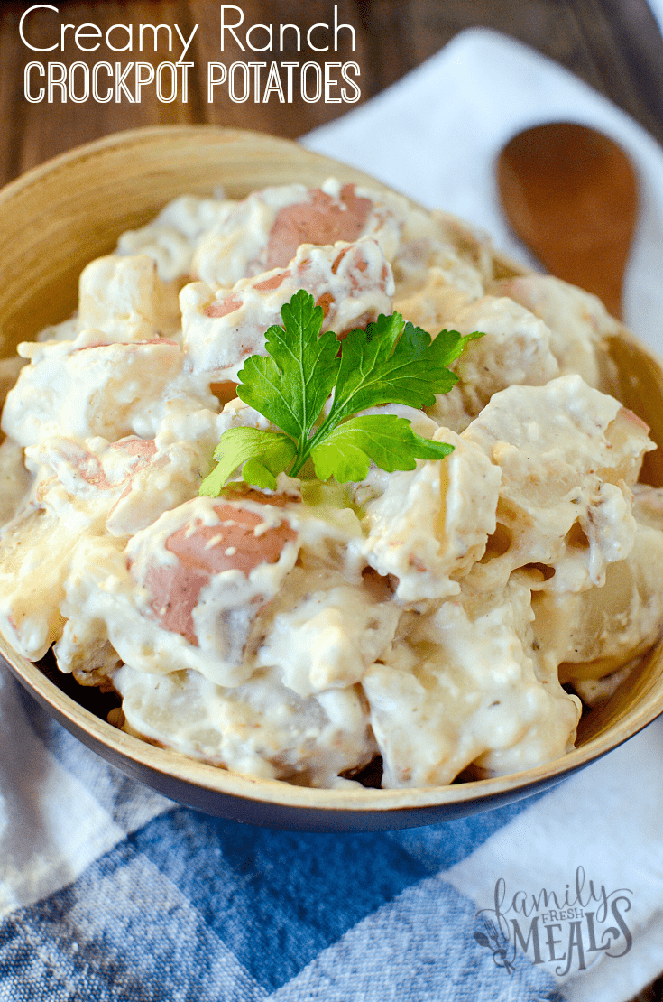 Creamy Ranch Crockpot Potatoes served in a wooden bowl