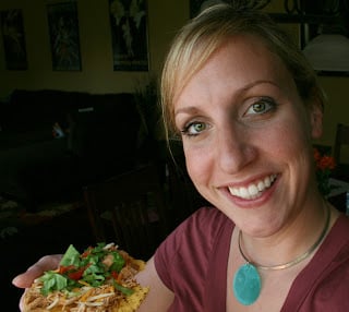 woman holding a tostada