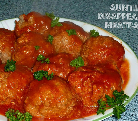 Large meatballs on a white plate
