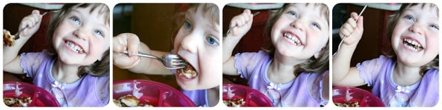 child sitting at a table eating cinnamon roll waffles