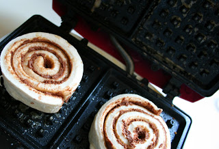 cinnamon rolls placed in waffle iron