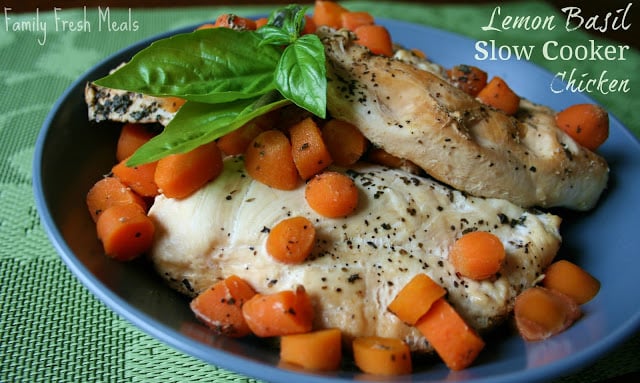 Lemon Basil Slow Cooker Chicken served on a blue plate with sliced carrots