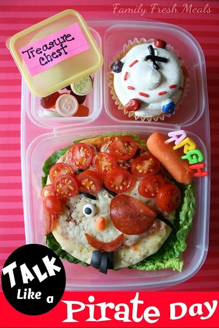 top down image of a school lunch box themed with pirate decorated foods