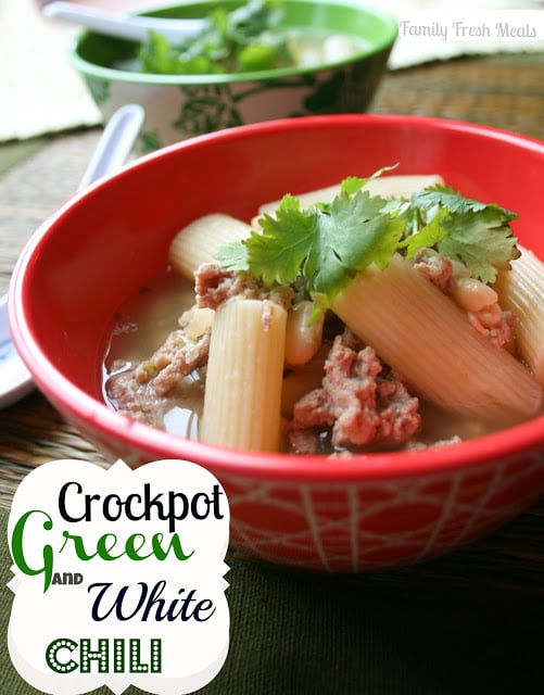 Green and White Crockpot Chili served in a read bowl