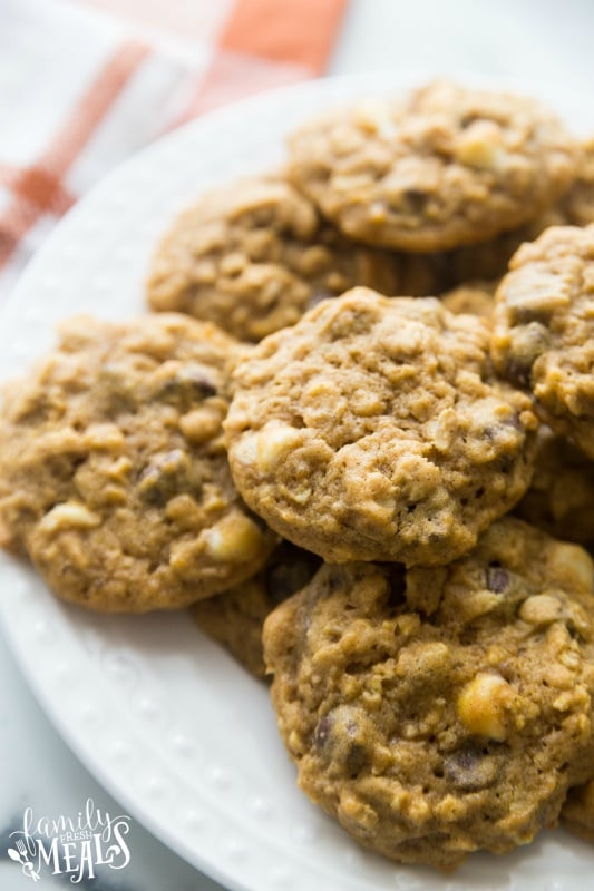 Pumpkin Oatmeal DOUBLE Chocolate Chip Cookies stacked on a white plate