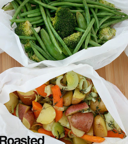 Top down image of two different sets of mixed vegetables in parchment packets