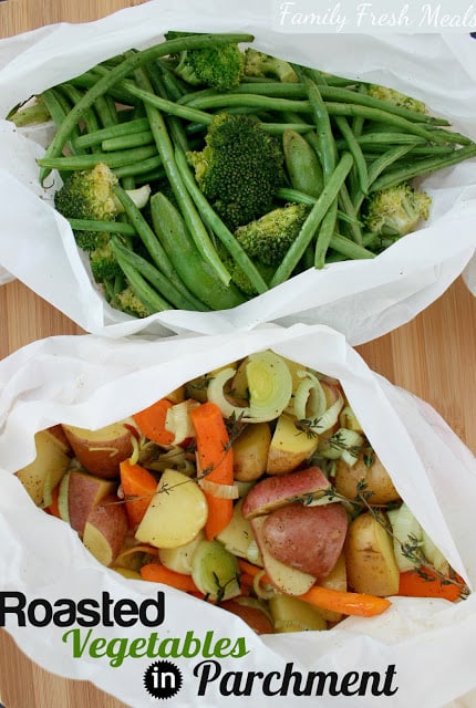 Top down image of two different sets of mixed vegetables in parchment packets