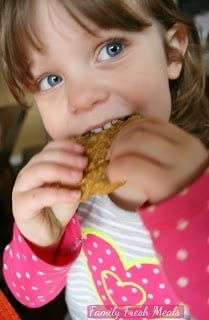 child eating a Pumpkin Oatmeal DOUBLE Chocolate Chip Cookie 