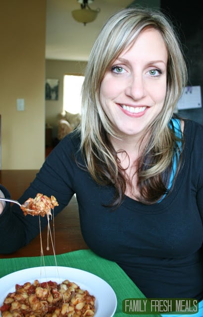 Lady sitting with bowl of Crockpot Lasagna Soup