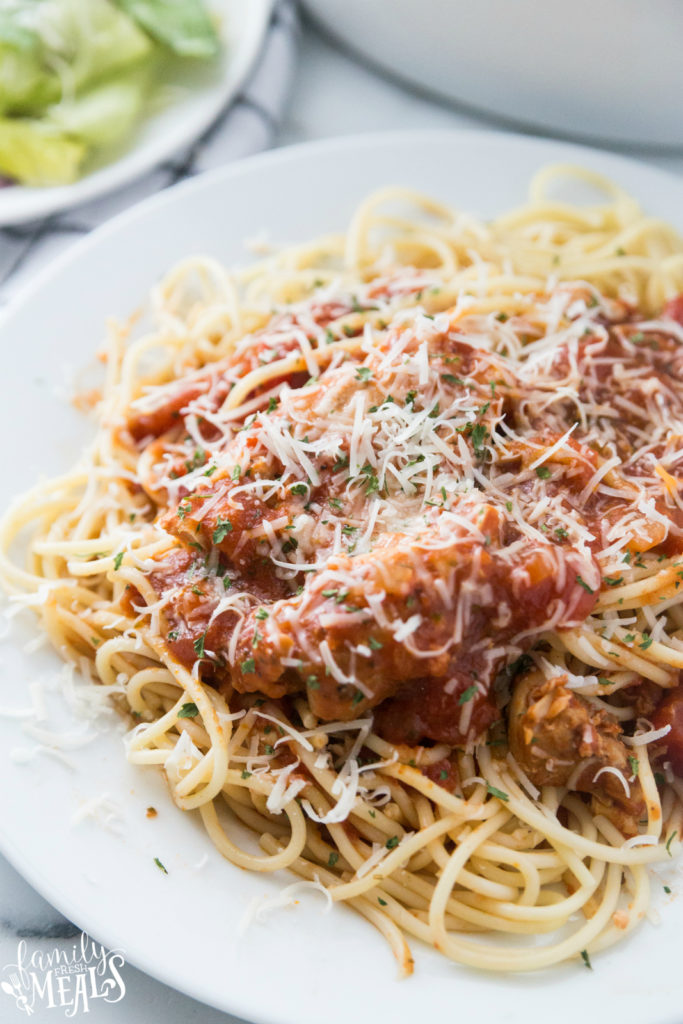 Crockpot Chicken Cacciatore Recipe served over pasta, on a white plate