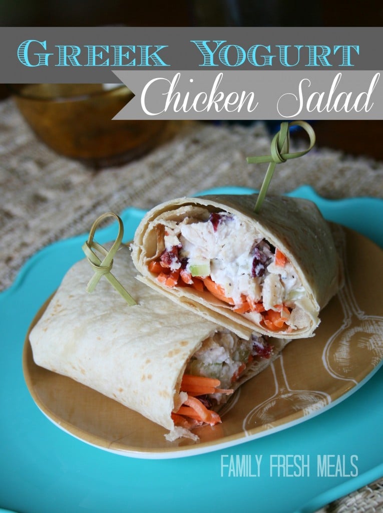 Greek Yogurt Chicken Salad served in a tortilla and cut in half on a plate