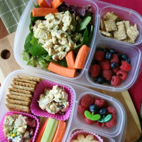 Top down image of 2 lunchboxes with curry chicken salad